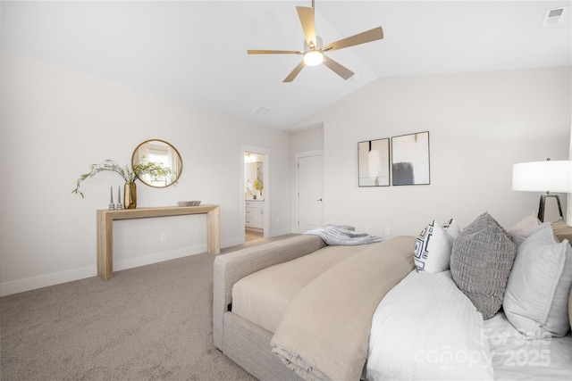 bedroom with light carpet, baseboards, visible vents, connected bathroom, and vaulted ceiling