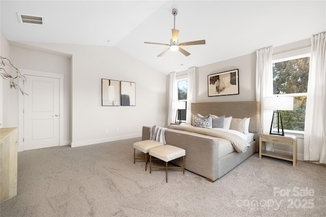 carpeted bedroom featuring vaulted ceiling, ceiling fan, visible vents, and baseboards