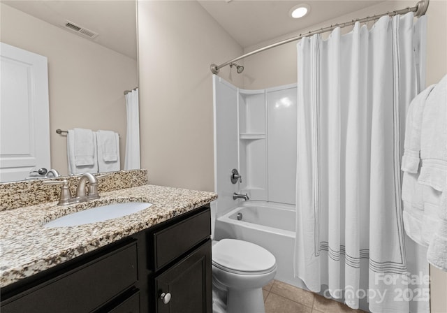 full bathroom featuring tile patterned floors, vanity, toilet, and shower / tub combo with curtain