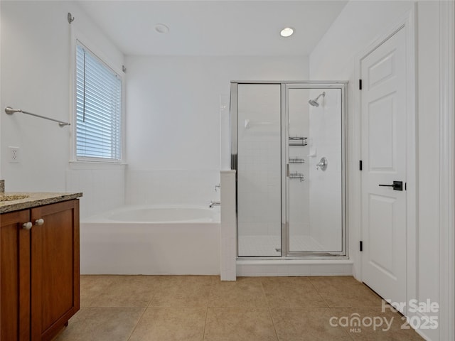 bathroom with vanity, plus walk in shower, and tile patterned floors