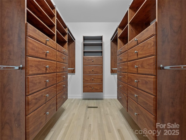 walk in closet featuring light wood-type flooring