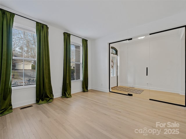 unfurnished bedroom with light hardwood / wood-style floors