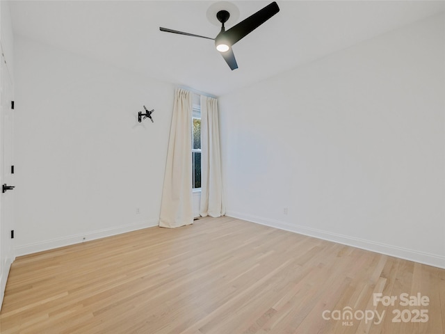 unfurnished room with ceiling fan and light hardwood / wood-style floors