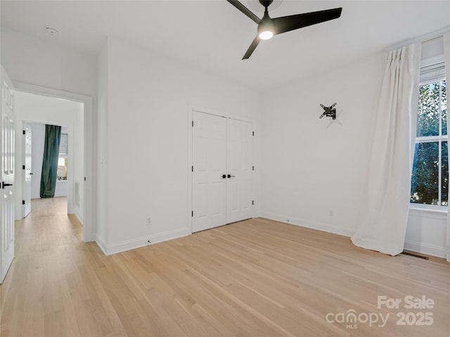 unfurnished room with light hardwood / wood-style floors and ceiling fan