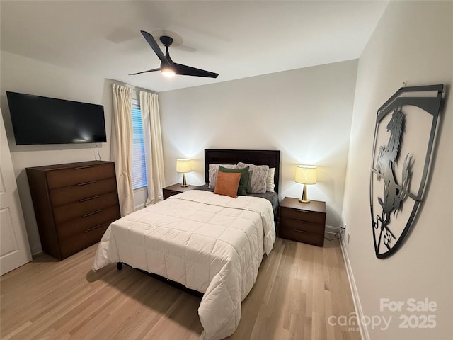 bedroom featuring ceiling fan and light hardwood / wood-style floors