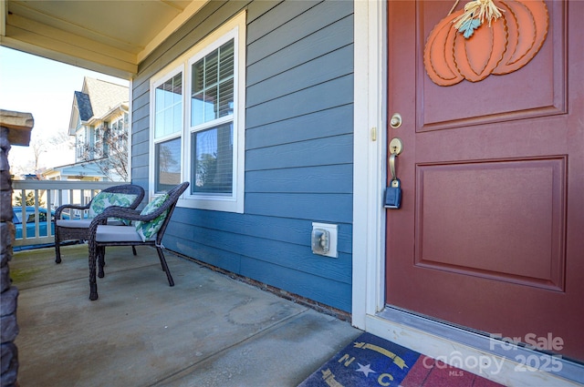 doorway to property with a porch