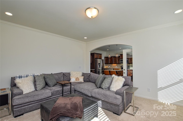 carpeted living room featuring crown molding