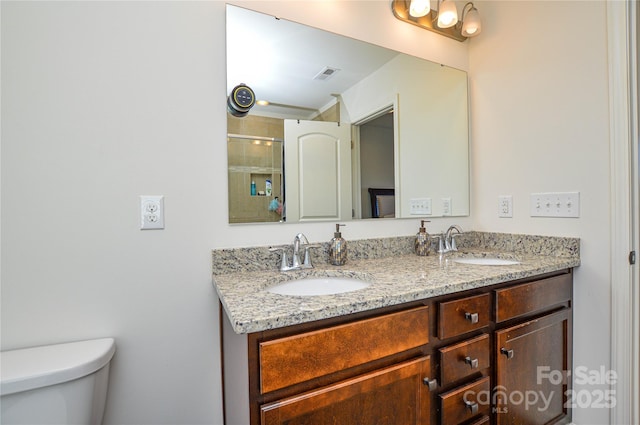 bathroom featuring walk in shower, vanity, and toilet