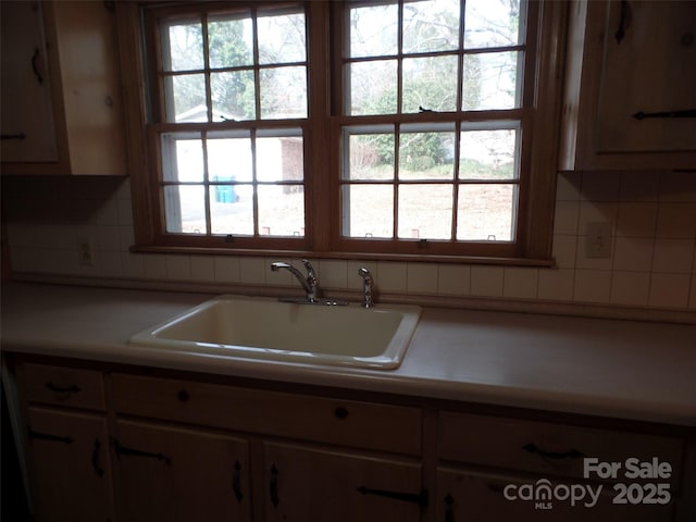 kitchen with decorative backsplash and sink