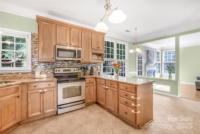 kitchen with range with electric cooktop, light tile patterned floors, hanging light fixtures, and ornamental molding