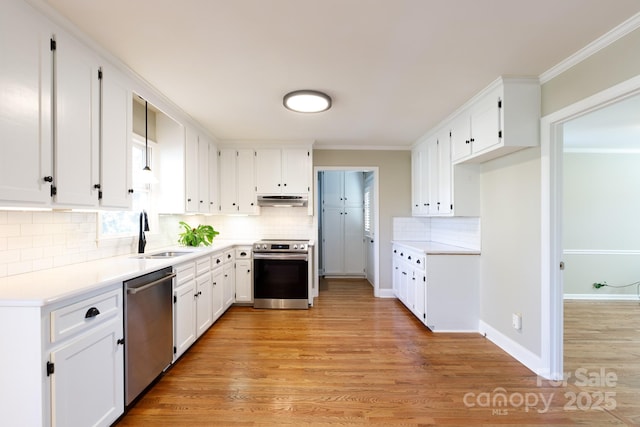 kitchen featuring light hardwood / wood-style flooring, stainless steel appliances, white cabinetry, and sink