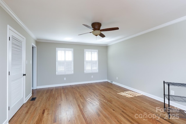 unfurnished bedroom featuring light hardwood / wood-style flooring, ceiling fan, and crown molding