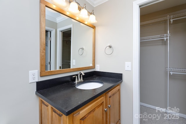 bathroom with vanity and ornamental molding