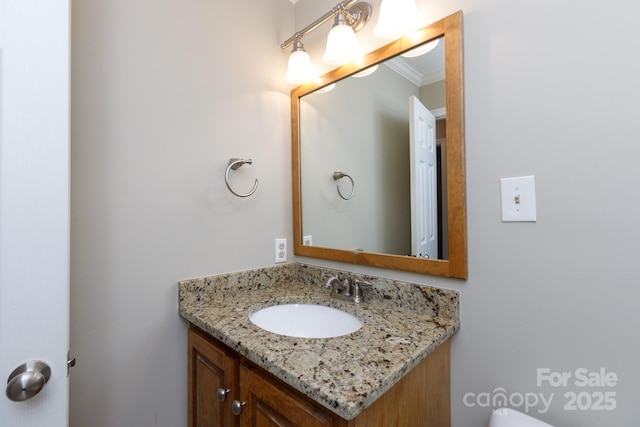 bathroom featuring vanity and crown molding