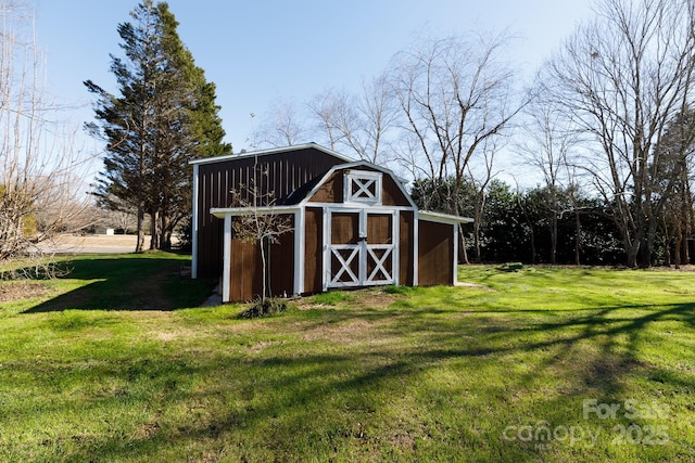 view of outdoor structure featuring a lawn