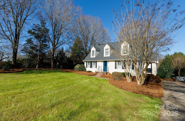 cape cod-style house with a front lawn