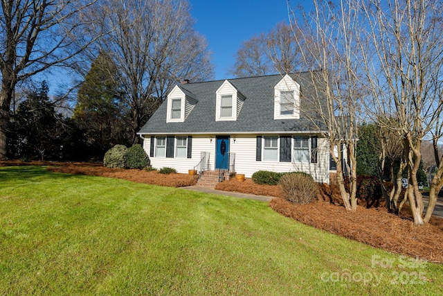 cape cod house featuring a front lawn