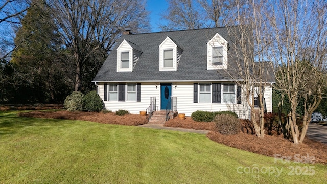 cape cod-style house featuring a front yard