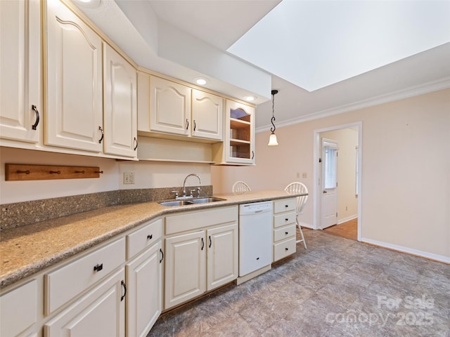 kitchen featuring dishwasher, sink, hanging light fixtures, a skylight, and ornamental molding