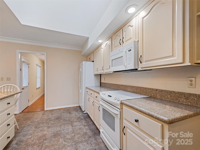 kitchen with white appliances, crown molding, and cream cabinets