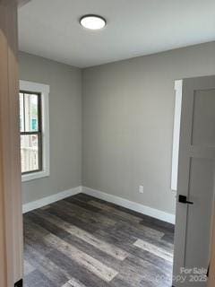 empty room featuring dark wood-type flooring