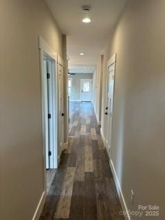 corridor featuring dark wood-type flooring