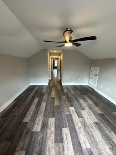 bonus room featuring ceiling fan, dark hardwood / wood-style floors, and lofted ceiling