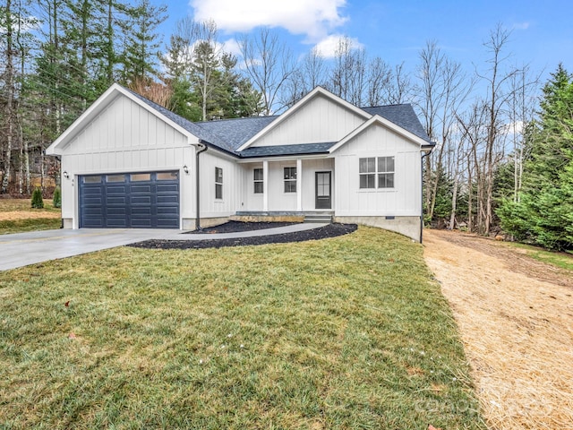 modern farmhouse featuring a garage and a front lawn