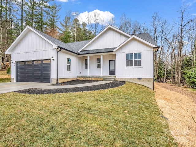 modern farmhouse style home with a front lawn and a garage