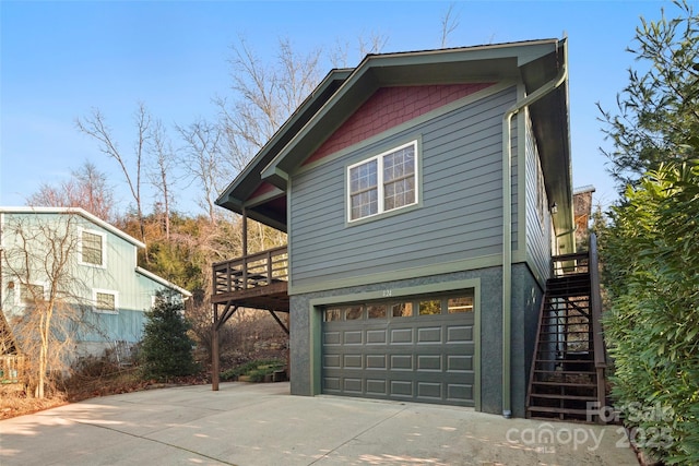 view of side of property featuring a garage