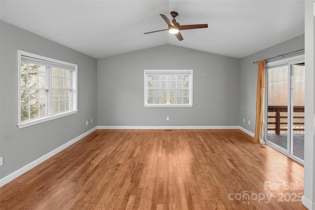 unfurnished room featuring ceiling fan, light hardwood / wood-style floors, and vaulted ceiling