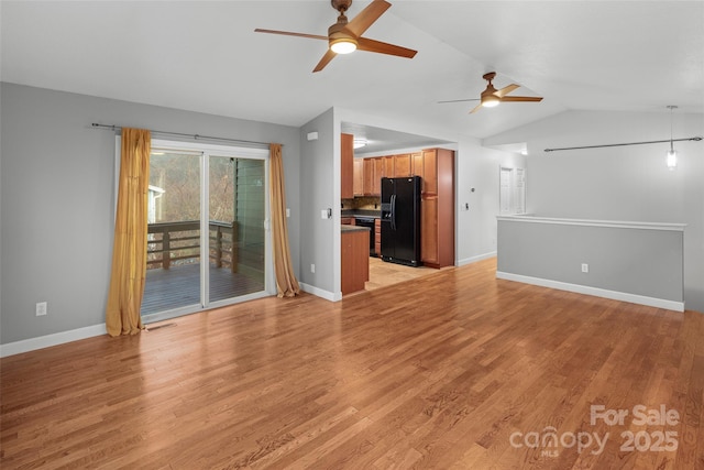 unfurnished living room with light hardwood / wood-style floors, ceiling fan, and lofted ceiling