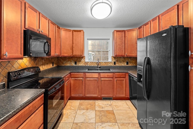 kitchen featuring a textured ceiling, sink, tasteful backsplash, and black appliances