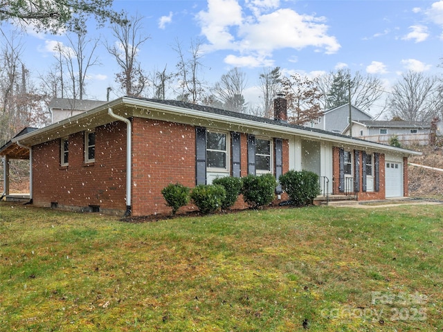 ranch-style home with a front lawn and a garage