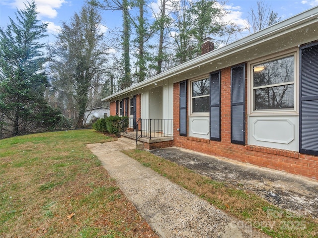 view of home's exterior featuring a yard