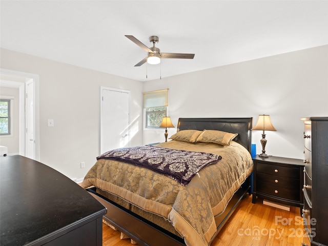 bedroom featuring ceiling fan and light wood-type flooring