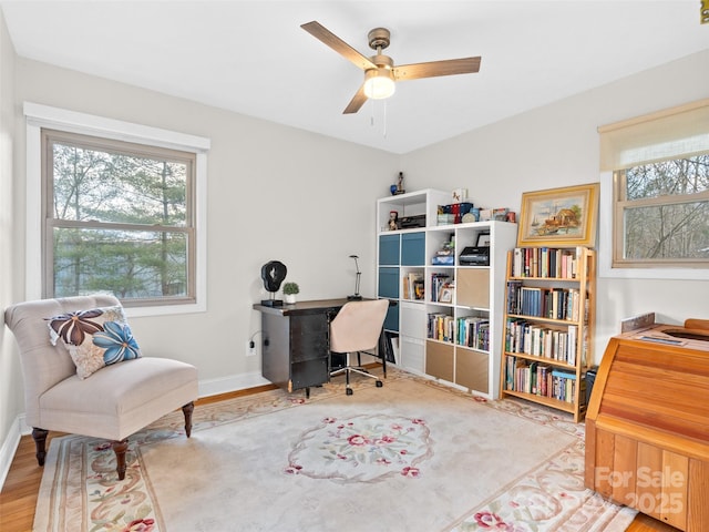 office area with hardwood / wood-style floors and ceiling fan