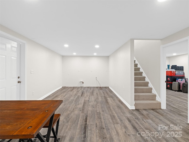 basement with hardwood / wood-style floors