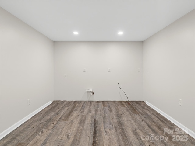 empty room with dark hardwood / wood-style flooring