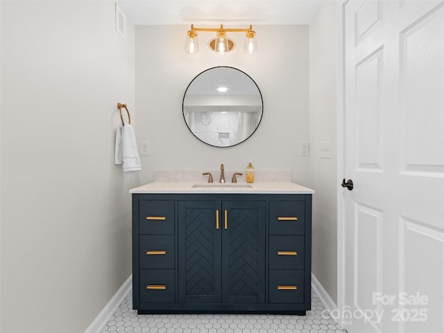 bathroom with vanity and tile patterned floors