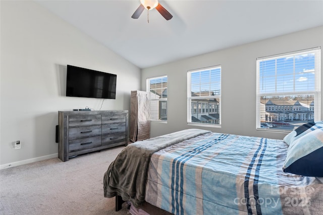 bedroom featuring ceiling fan, light carpet, and vaulted ceiling