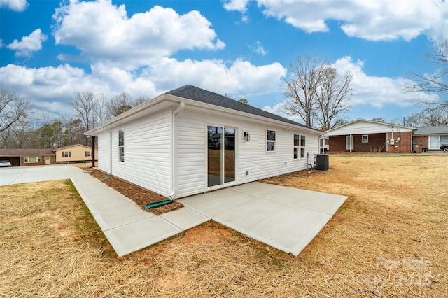 back of house with a patio, a lawn, and cooling unit