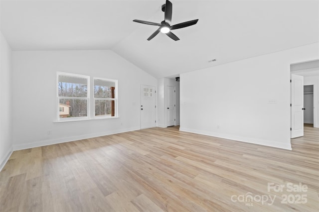 interior space with visible vents, baseboards, ceiling fan, vaulted ceiling, and light wood-type flooring