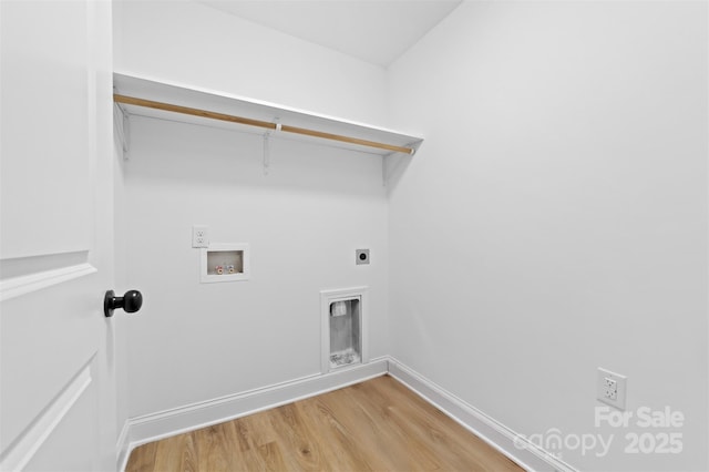 clothes washing area featuring hookup for a washing machine, hookup for an electric dryer, laundry area, baseboards, and light wood finished floors