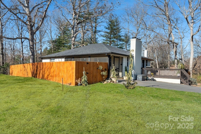 rear view of property with a yard