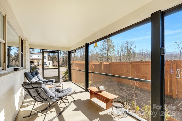 sunroom / solarium featuring a healthy amount of sunlight