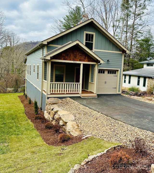 view of front facade with a porch and a garage