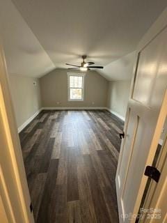 additional living space featuring dark hardwood / wood-style floors, ceiling fan, and vaulted ceiling