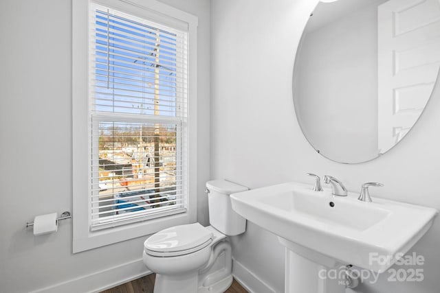 bathroom featuring toilet and sink