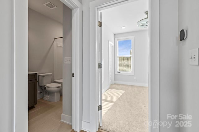 bathroom featuring toilet and vanity